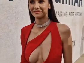 Nina Dobrev sexy - Ample cleavage in peekaboo scarlet dress (2022)